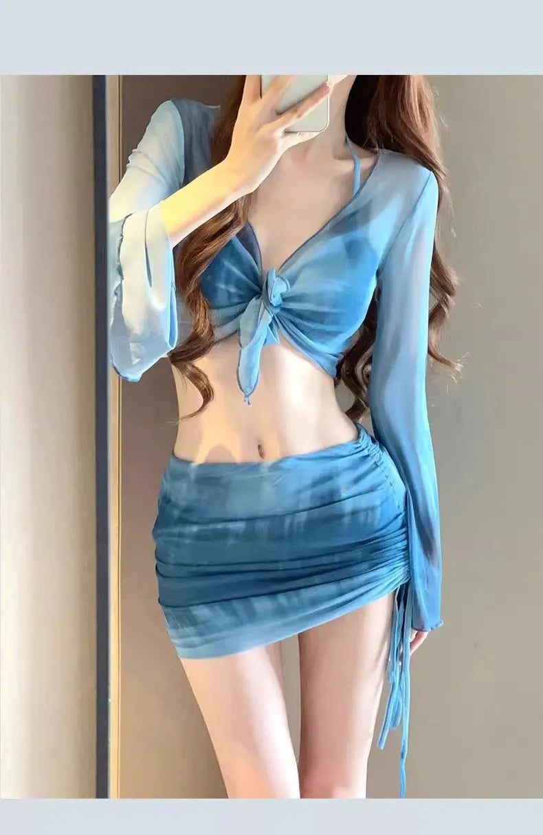 Women's blue high-waisted bikini four-piece set with shirt and skirt on a mannequin