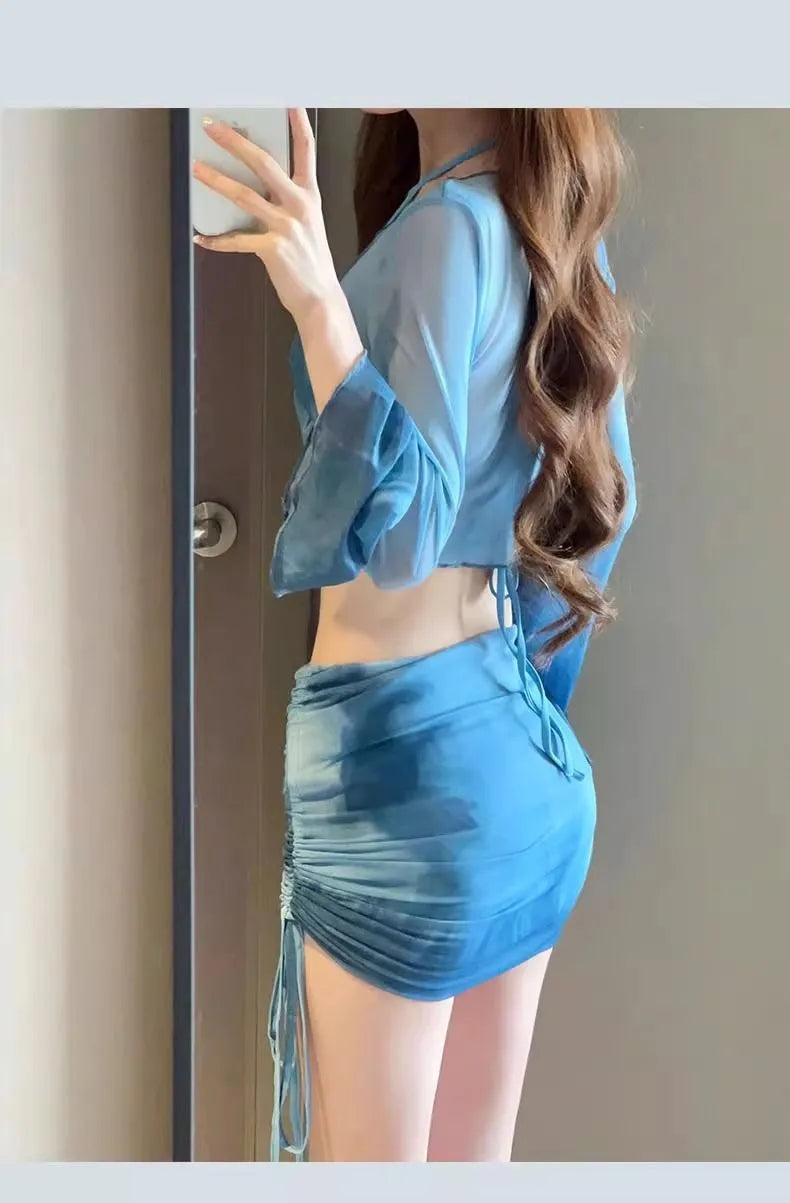 Women's blue high-waisted bikini four-piece set with shirt and skirt on a mannequin
