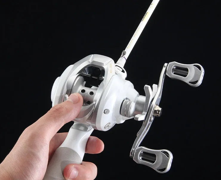 Small white micro drop wheel bait casting fishing reel on a rod