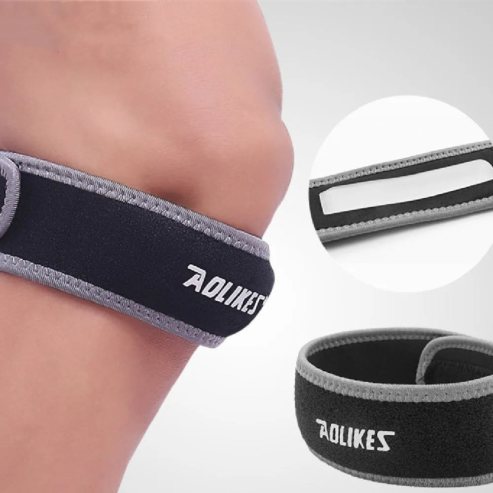 Black and grey patella retinaculum knee support for running and sports.