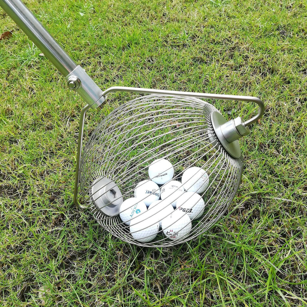 A metallic-coloured stainless steel golf ball picker or retriever tool on a green background.