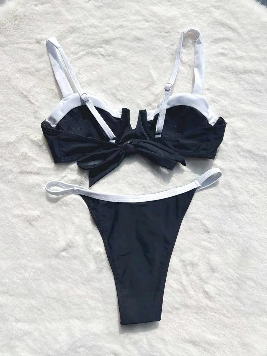 Black low waist women's bikini swimsuit with stitching split detail on the briefs.