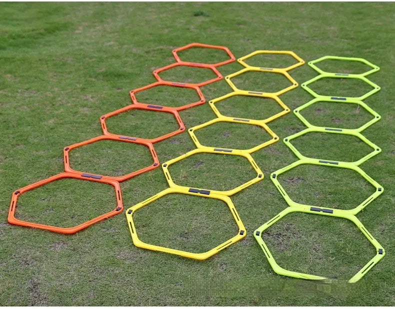 Set of six foldable hexagonal football agility training rings in yellow, green, and orange colours.