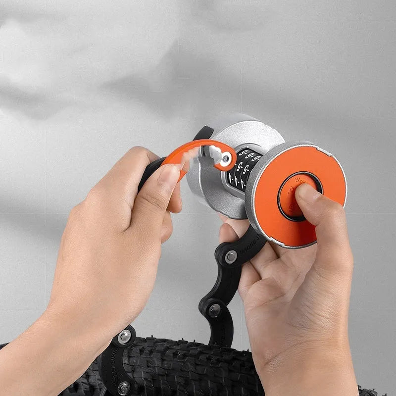 Portable bicycle folding lock in black orange colour showing folded compact design