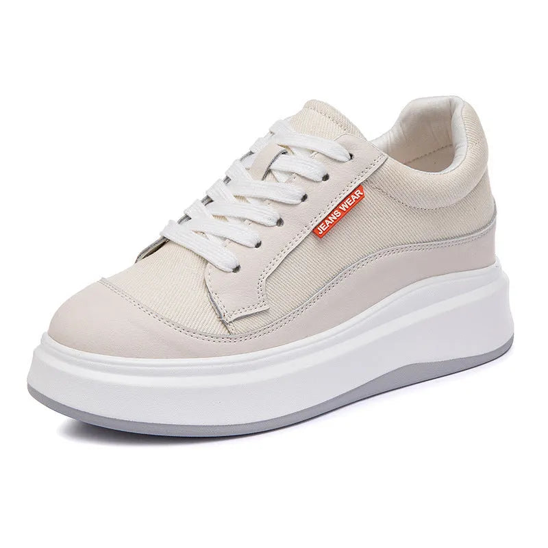 Women's beige leather board shoes with a thick platform sole on a white background.