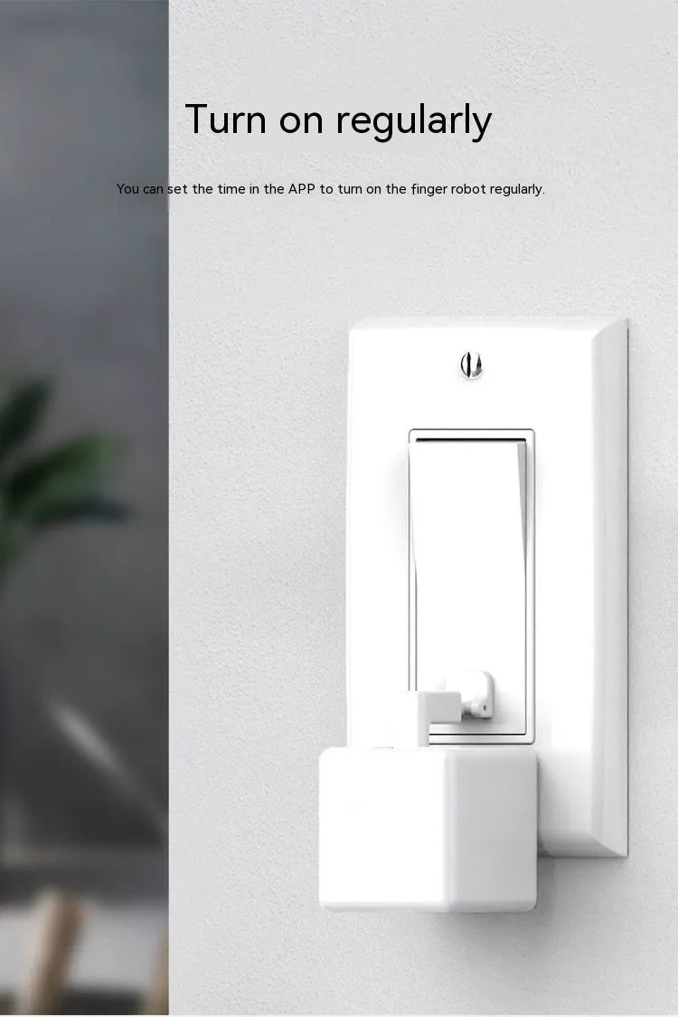 Graffiti smart home Bluetooth finger robot attached to a wall switch, white model