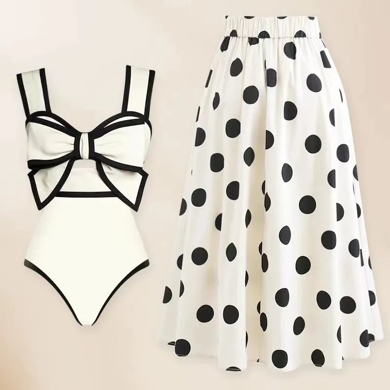 Women's one-piece swimsuit with beach dress style skirt and bow detail in polyester fabric