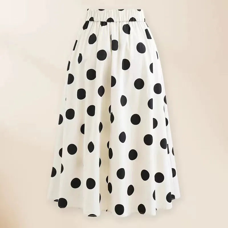 Women's one-piece swimsuit with beach dress style skirt and bow detail in polyester fabric