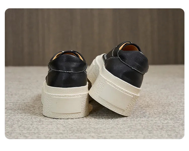Women's black and white platform sports board shoes with embossed cowhide uppers and round toe design
