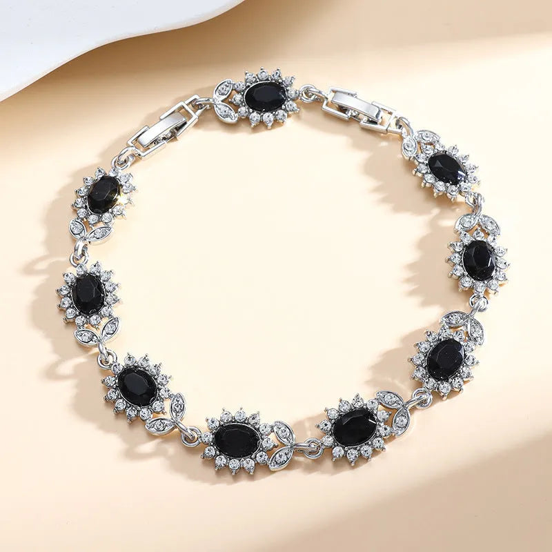Women's simple zircon bracelet with gemstone inlay in environmental alloy, showing clasp closure and sparkling details