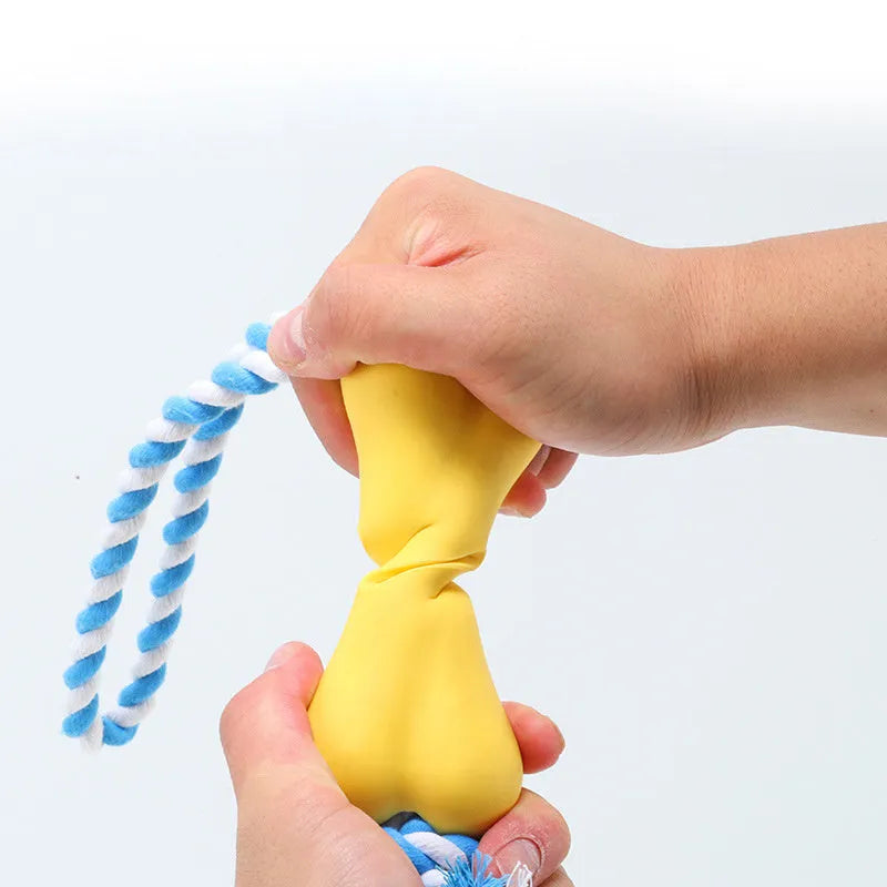 Green porous bone-shaped rope knot dog toy for chewing and holding treats.