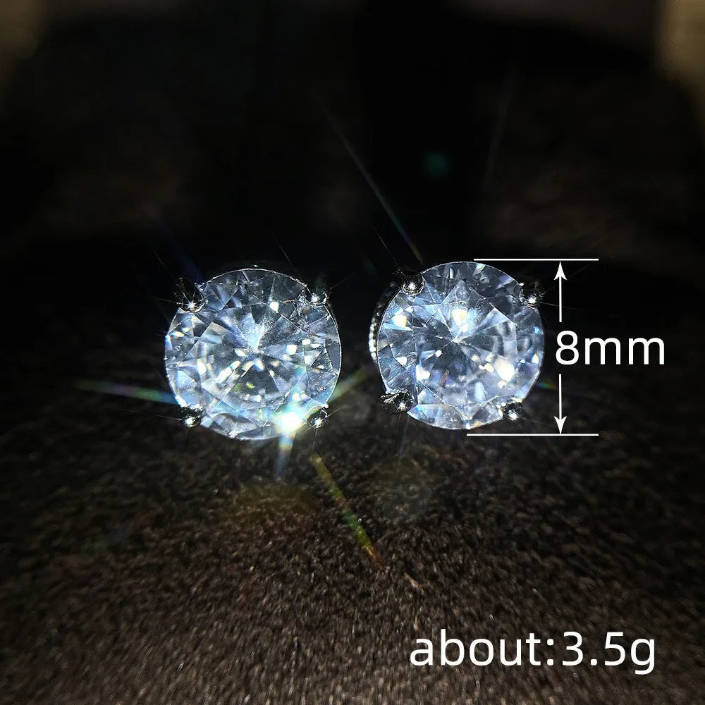 Women's round white zircon stud earrings with copper geometric round shape on display