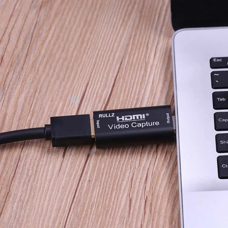 Black HDMI video capture card with USB connector, 64x28x13mm, supporting 4K input and 1080P output