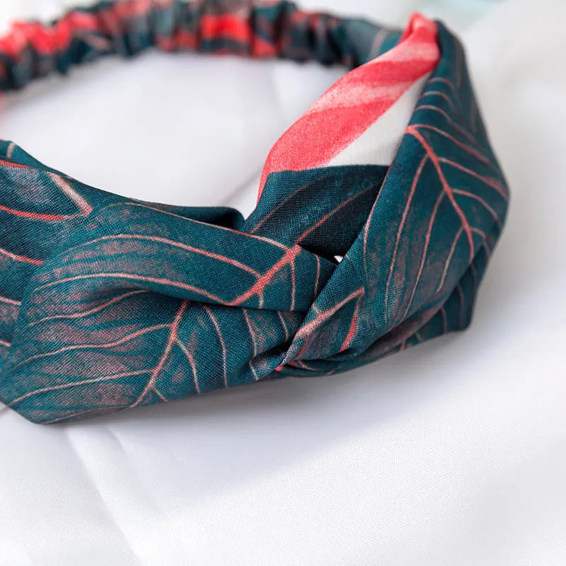 Red cloth headband with embroidered banana leaf cross pattern for women's festival wear