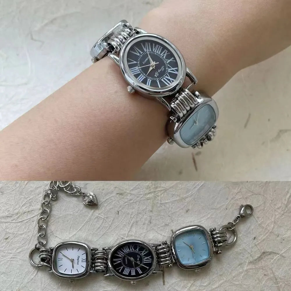 Men's vintage retro punk watch with purple dial and metal bracelet on display