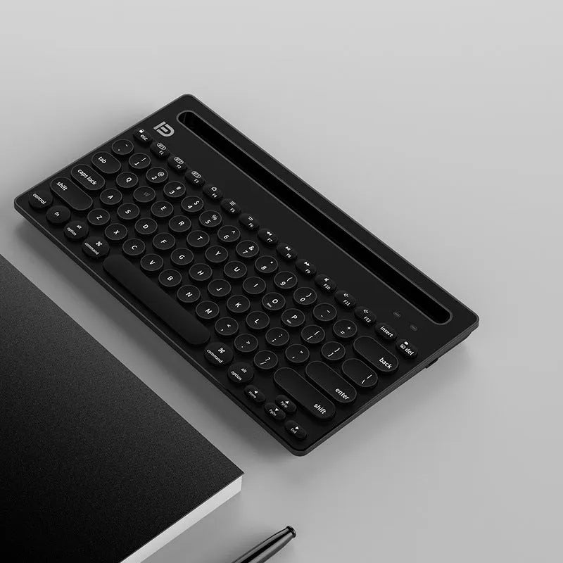 Wireless Bluetooth keyboard in black, compact 297x178x22mm size, slim profile on desk