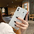 Transparent coloured TPU mobile phone case for Apple iPhone on a white background.