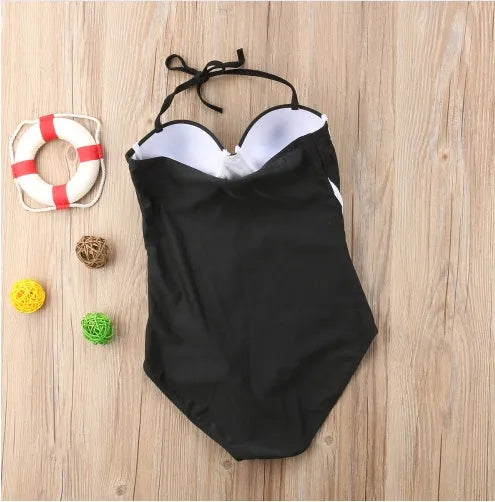 Black one-piece swimsuit shown in sizes S, M, L, and XL for swimming and beach use