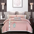 Four-piece cotton embroidery bedding set with floral patterns on satin weave fabric