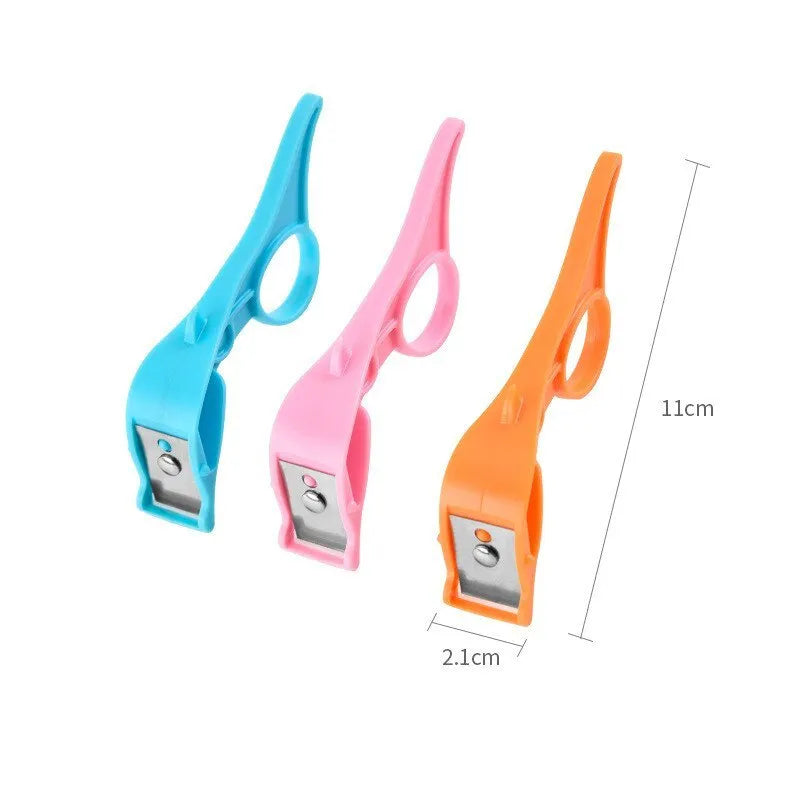 Multifunctional finger ring fruit peeler with stainless steel blade in orange, blue, and pink colours