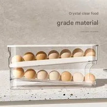 White plastic slide-out egg tray with automatic dispenser on a kitchen countertop