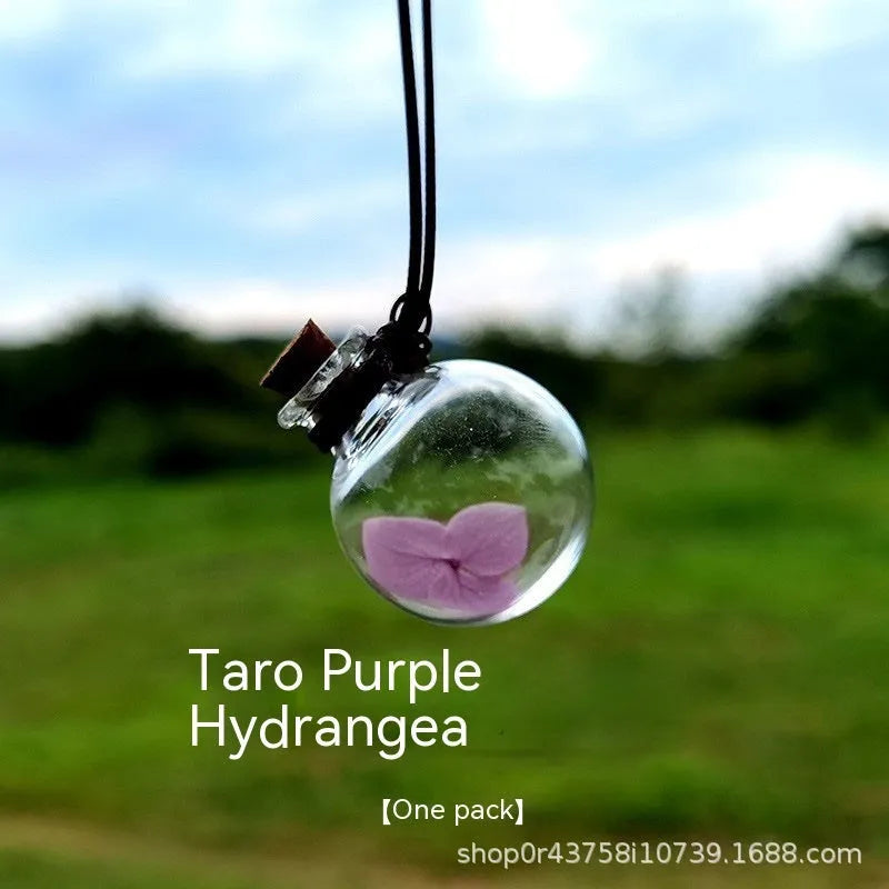 Glass car perfume pendant with preserved flowers for interior decoration and air freshening