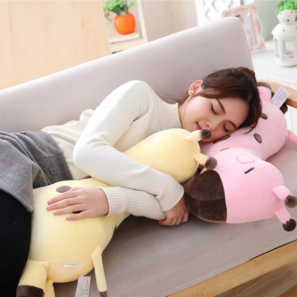 Pink Sika Deer plush doll with short plush fabric, 30cm tall, on a bed