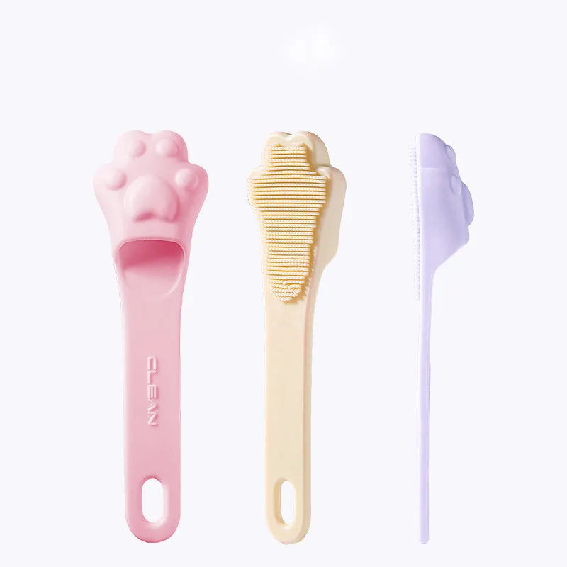 Pink silicone finger cover toothbrush for pets on a white background