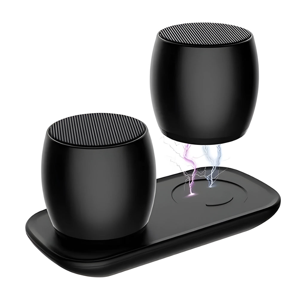 Creative Bluetooth speaker pair in black and silver on a charging base