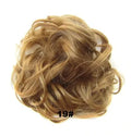 Adjustable hair ring in a natural black shade for creating hair buns and ponytails