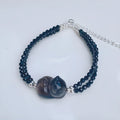 Natural obsidian bracelet with carved climbing cat charm in K2 cold obsidian stone