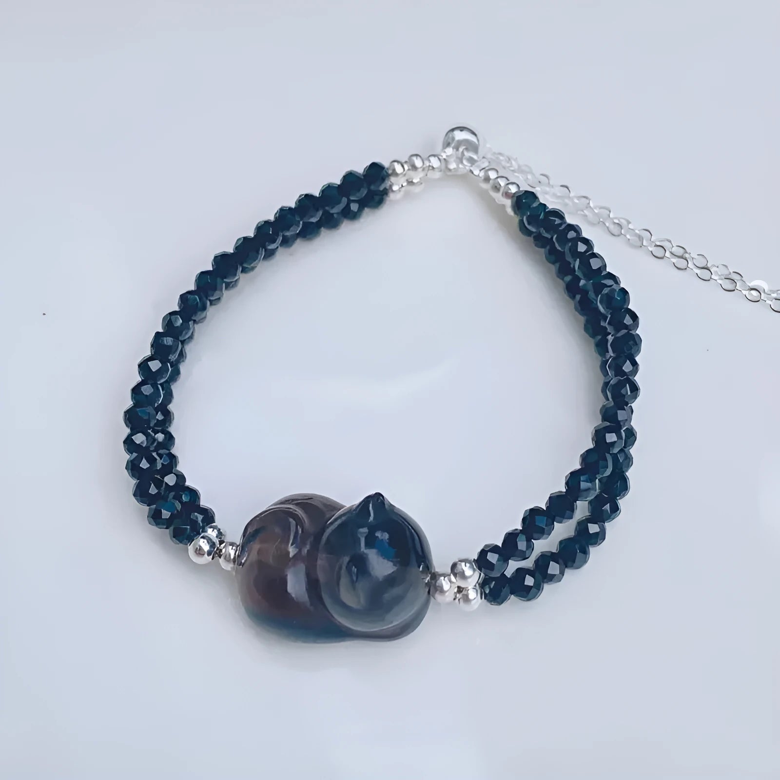 Natural obsidian bracelet with carved climbing cat charm in K2 cold obsidian stone
