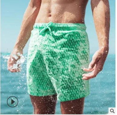 Thermochromic children's polyester shorts in solid blue colour changing to green when warm