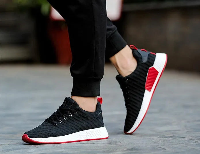 Men's Malcom low-top sneaker with mesh fabric upper and MD sole in black, grey, and white
