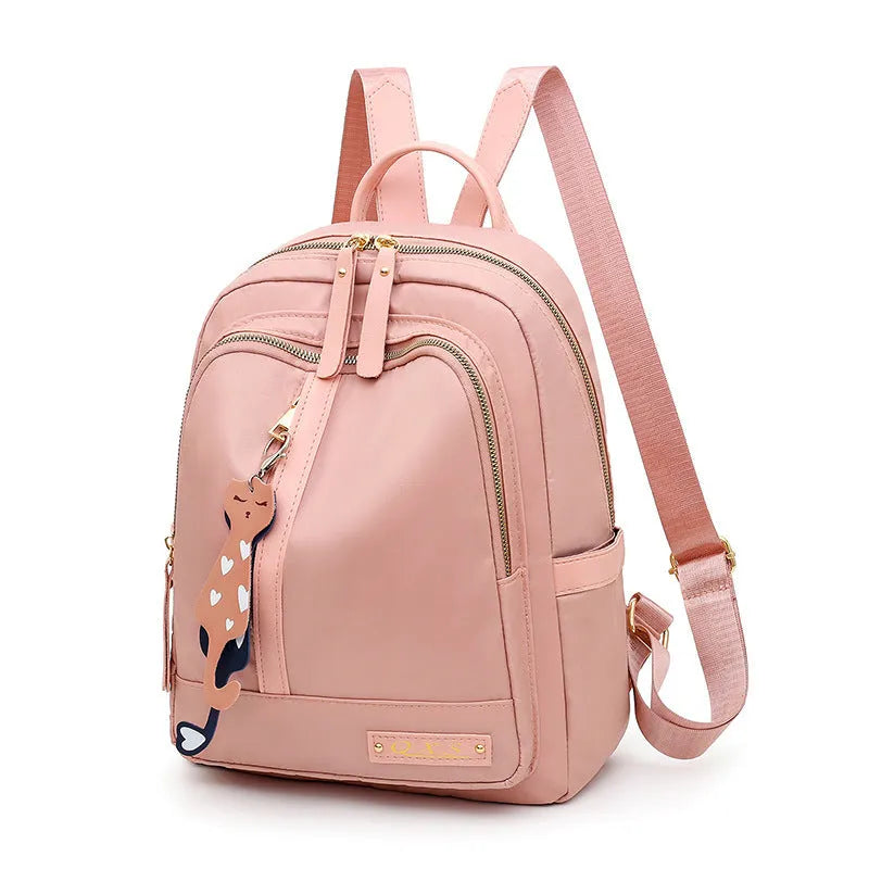 Soft black nylon women's casual backpack with double straps, external pocket, and internal organisers.