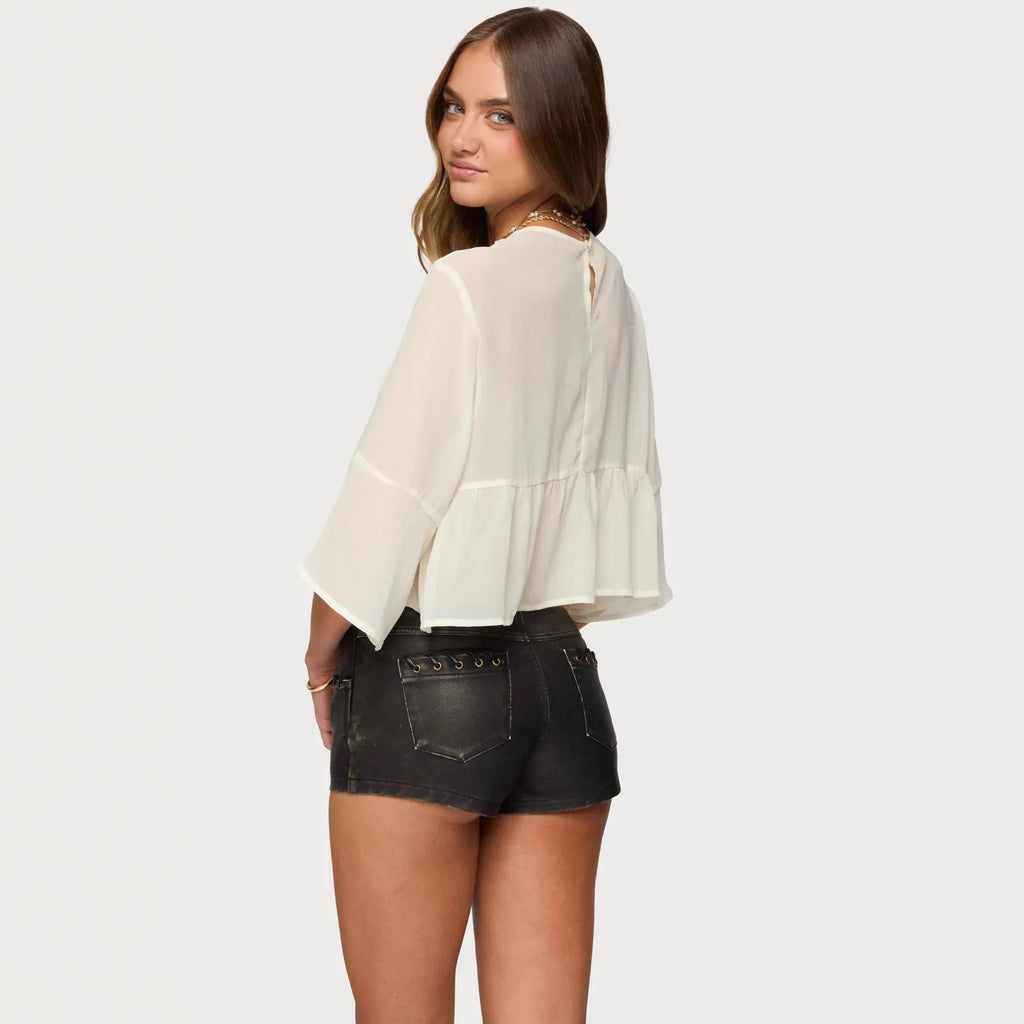 Women's milky white chiffon top with batwing sleeves showing short length and relaxed fit