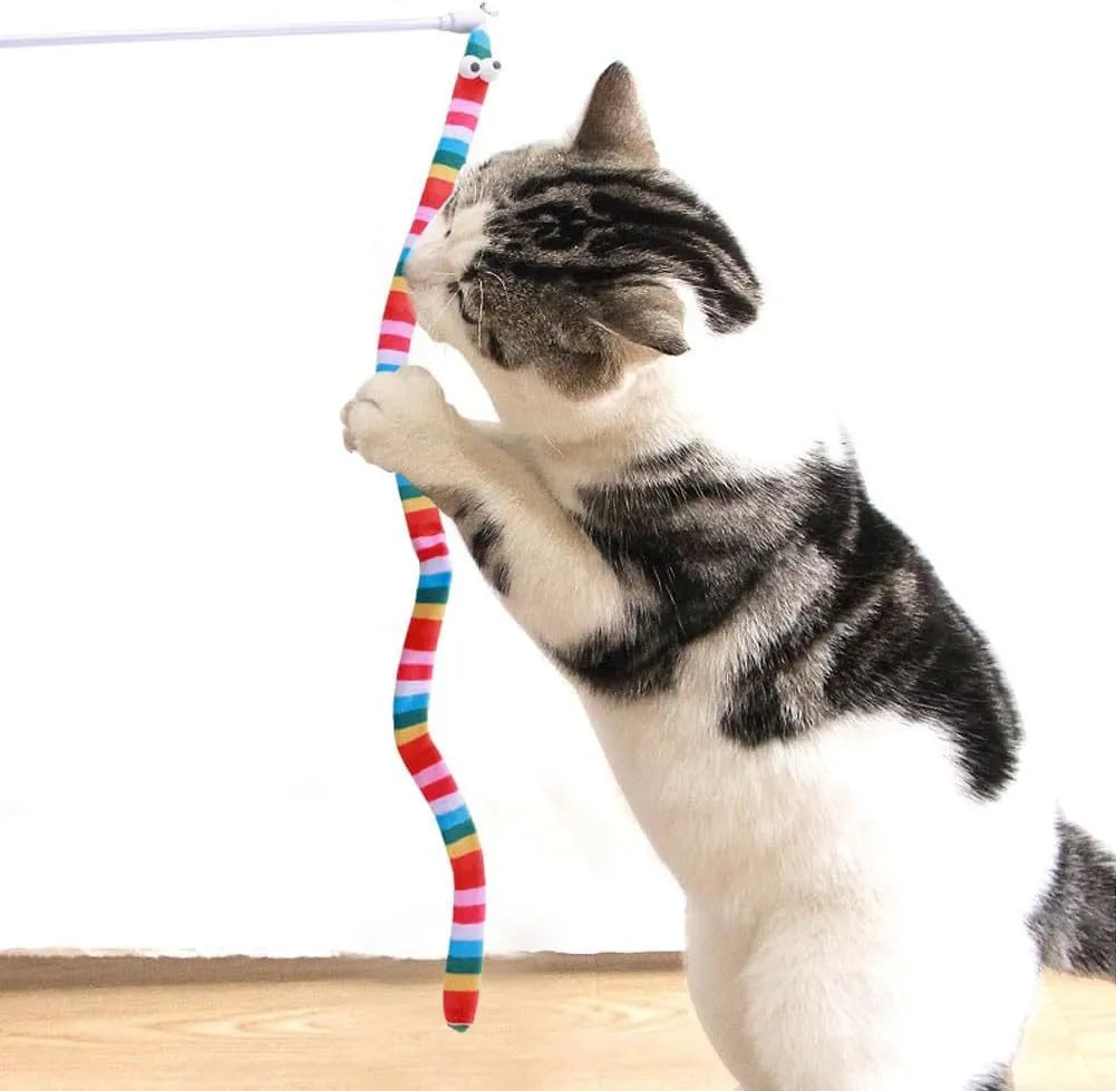 Cat wand teaser toy with a polycarbonate handle and a long green plush strip with a bell.