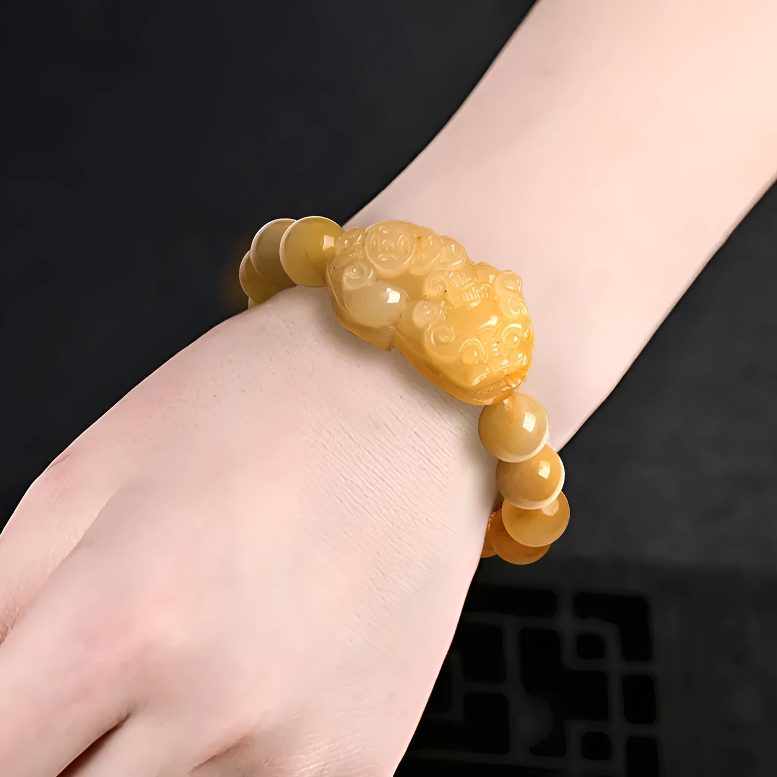 Carved Jinsi Jade Money Bracelet showing golden thread patterning, displayed in large and small size options.