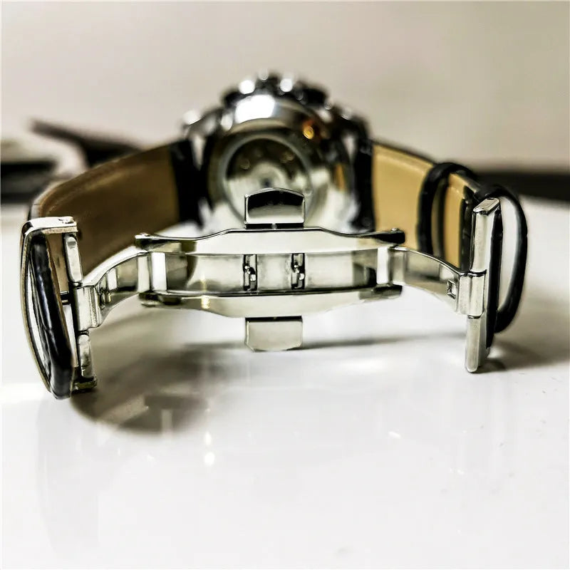 Men's automatic mechanical watch showing multifunction dial on a 12mm thick case in a silver and black colour variant.