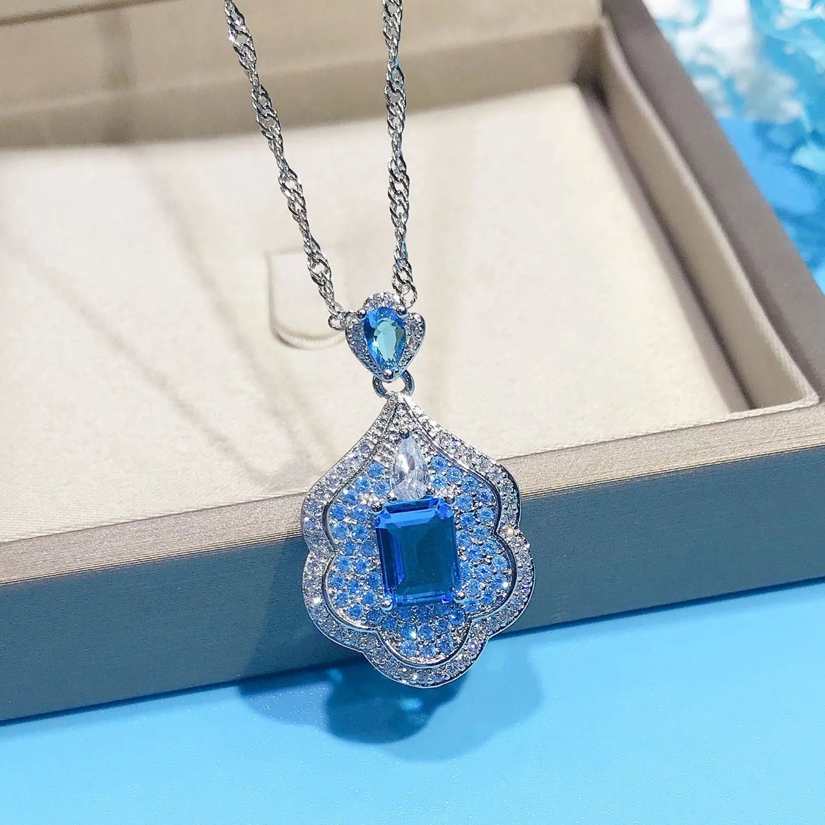 Sea blue geometric copper pendant with aquamarine and topaz mirror finish jewellery piece