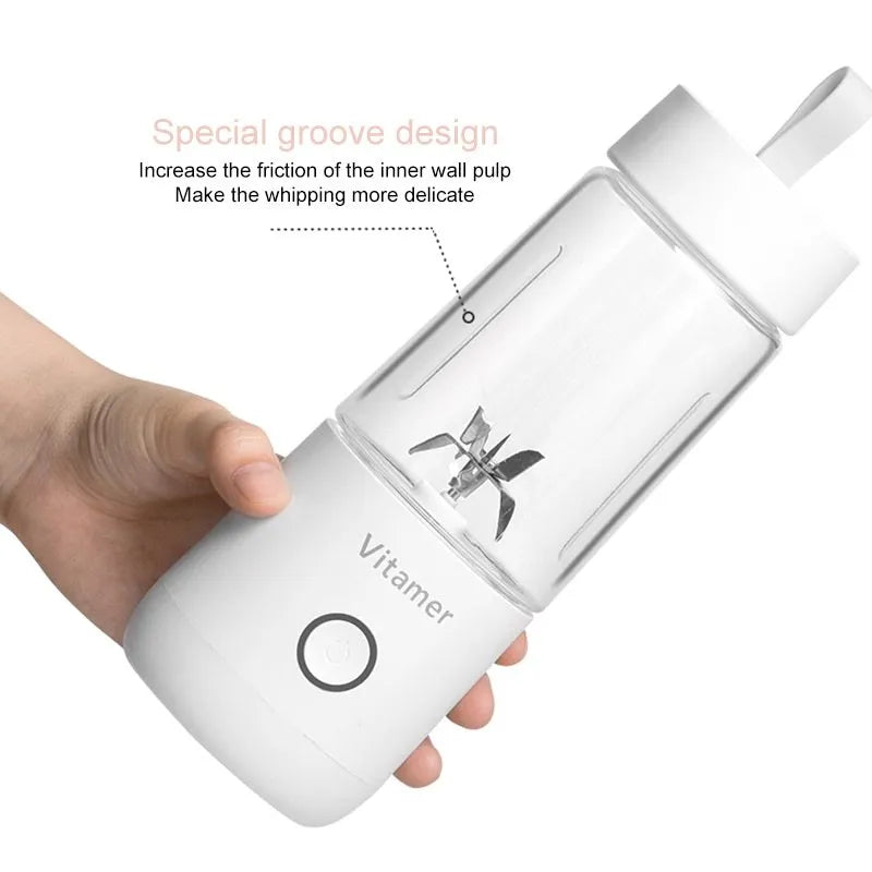 White portable USB blender with 350ml cup and silicone carry ring on a base.