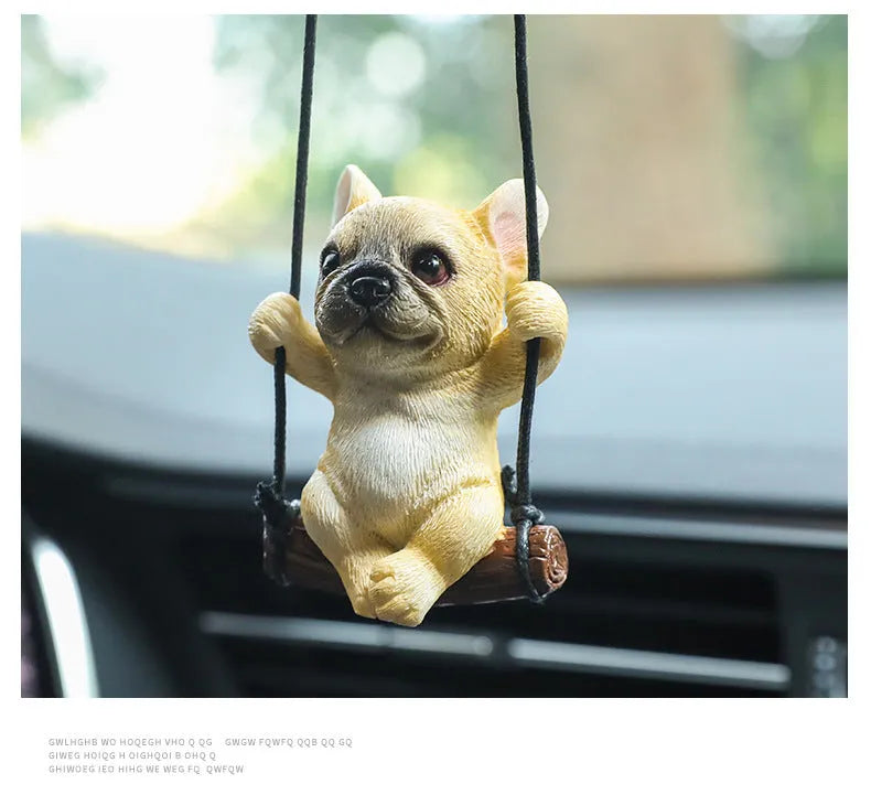 Small resin bulldog cartoon pendant for hanging on a car rearview mirror.