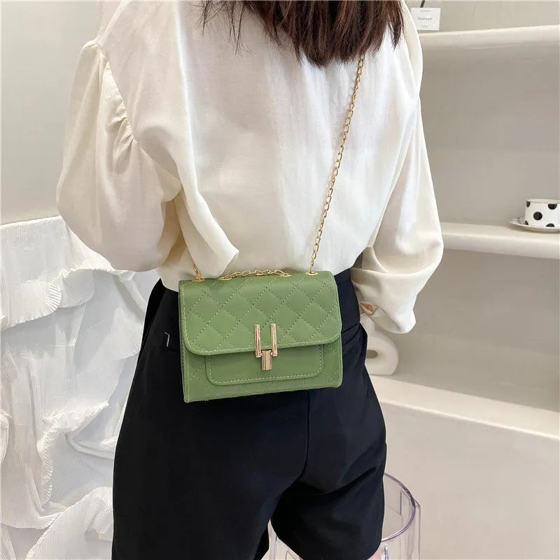 Women's diamond lattice pattern crossbody bag with chain strap in black, white, or green PU leather