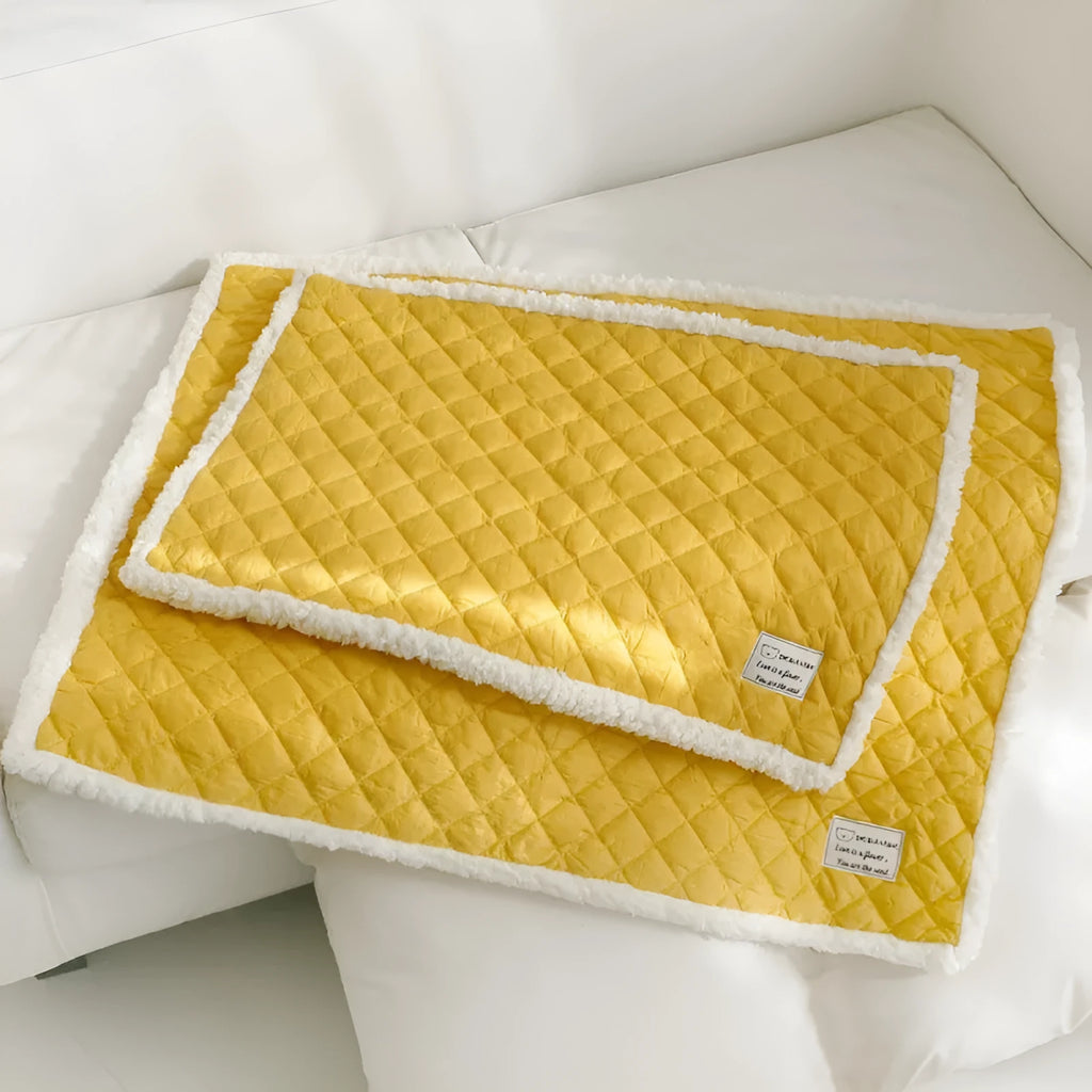 Soft blue terry cloth pet blanket for cats, shown on a pet bed, with size and colour options displayed.