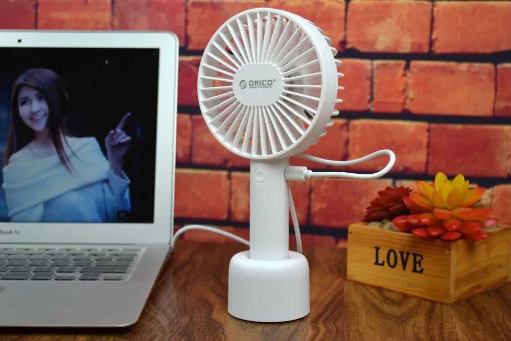 White ORICO FH1 portable USB rechargeable small fan on a desk