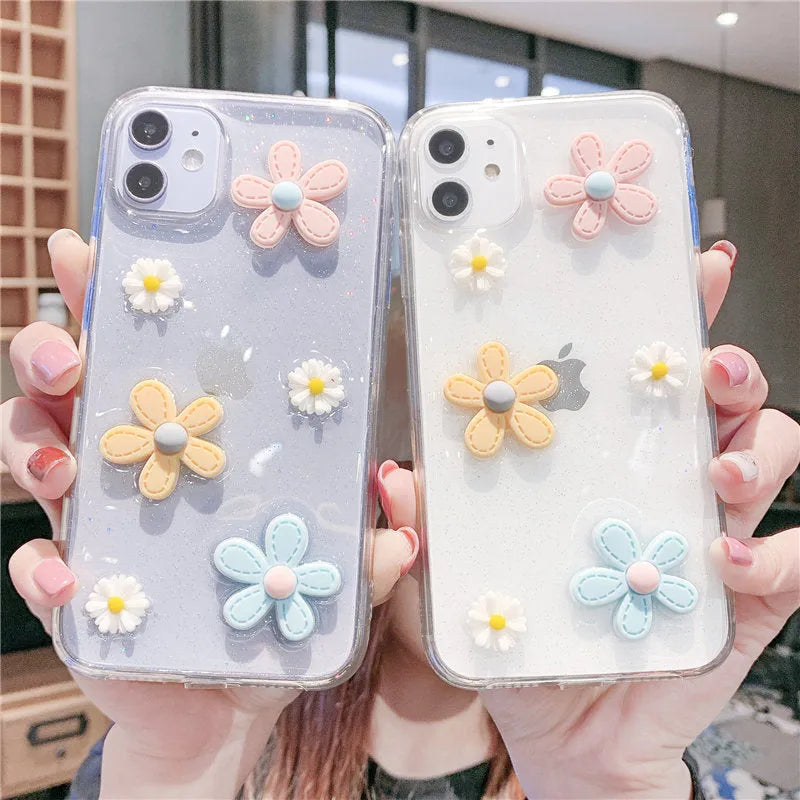 Soft rubber iPhone case with pink floral and girl heart pattern, shown fitted on a phone.