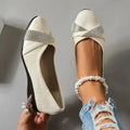 Black women's slip-on casual shoes with round toe, rhinestone detail, and a short chunky heel.