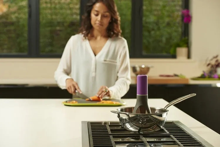 Green automatic cooking mixer device for stirring sauces and soups in pot