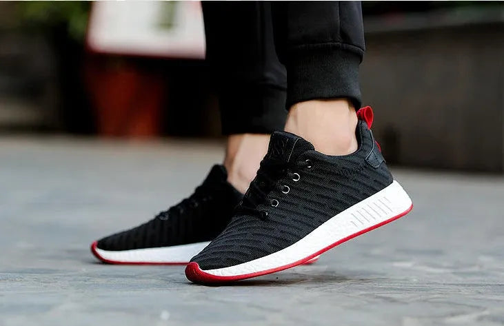 Men's Malcom low-top sneaker with mesh fabric upper and MD sole in black, grey, and white