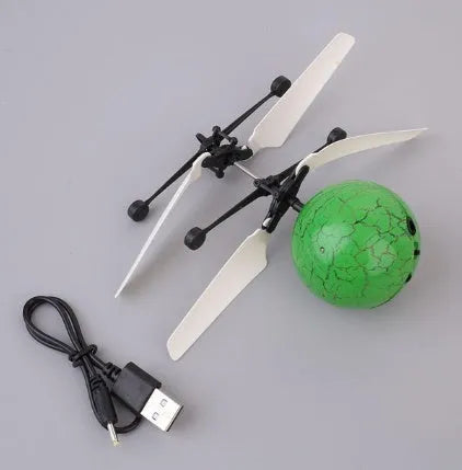 LED Magic Flying Ball with infrared induction and flashing LED lights in a child's hand